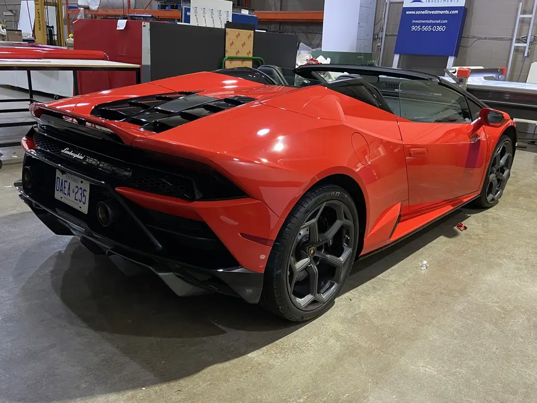 Red Lamborghini Huracan with custom vinyl wrap by Toronto Car Wrap Shop – premium exotic car wrapping service in Ontario