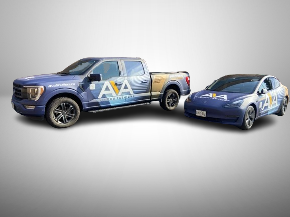 Custom commercial vehicle wraps for AVA Window Fashions featuring branded designs on a pickup truck and Tesla, created by Toronto Car Wrap for professional fleet marketing